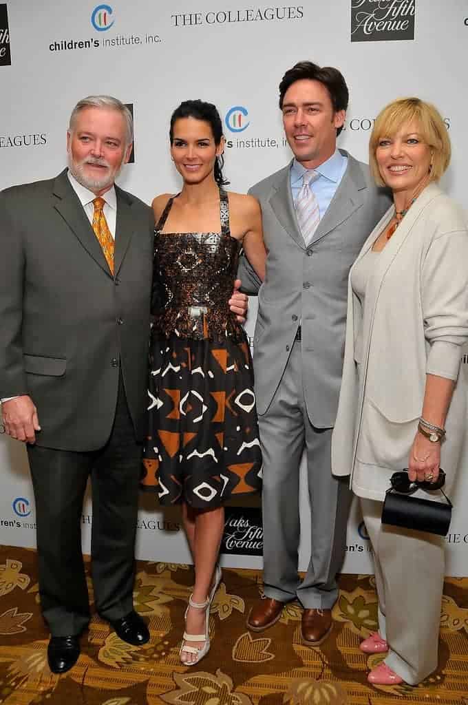 Image of Angie Harmon with her parents, Lawrence Paul Harmon and Daphne Demar Caravageli