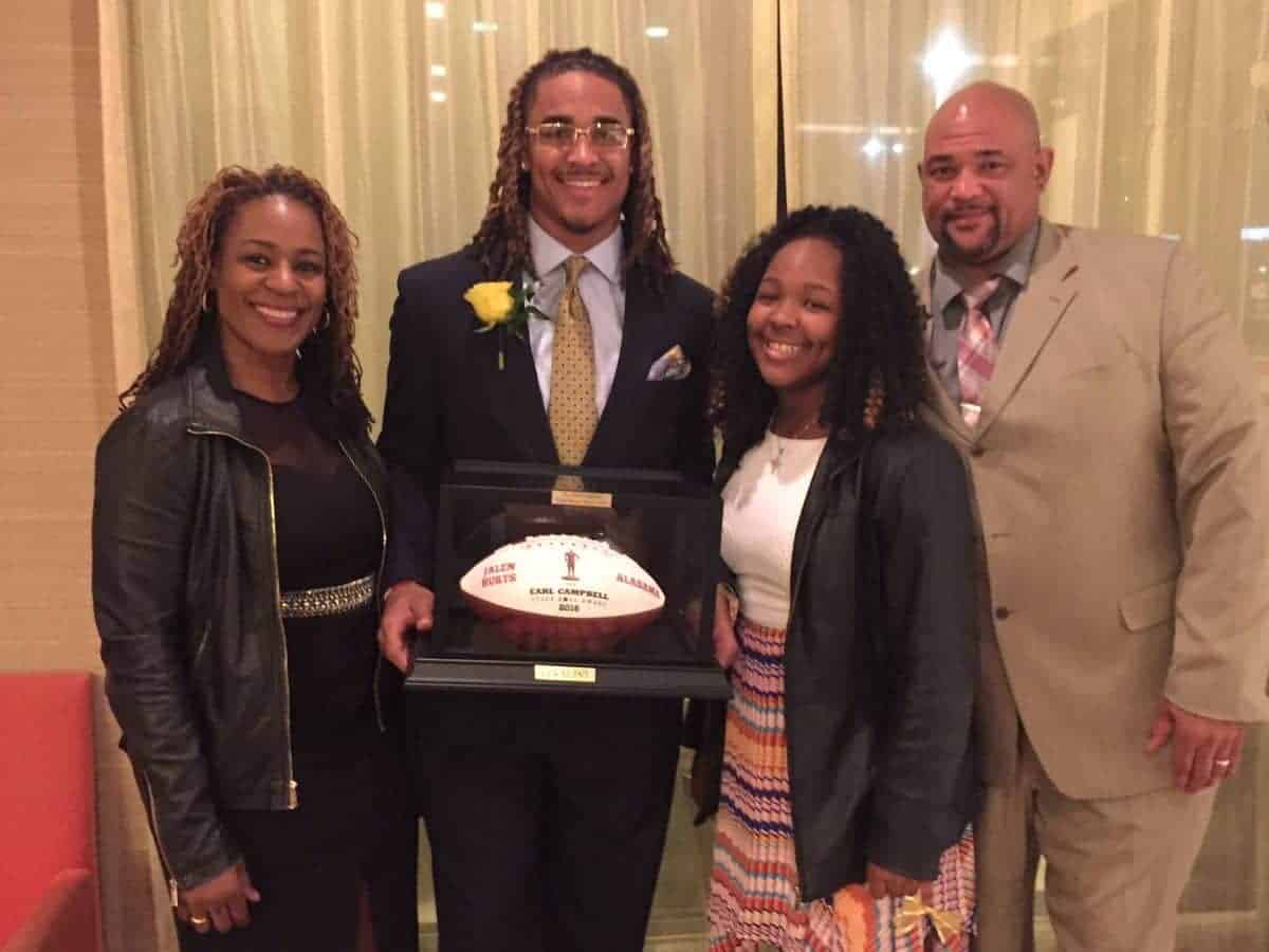 Image of Jalen Hurts with his parents and sister, Kynnedy Hurts
