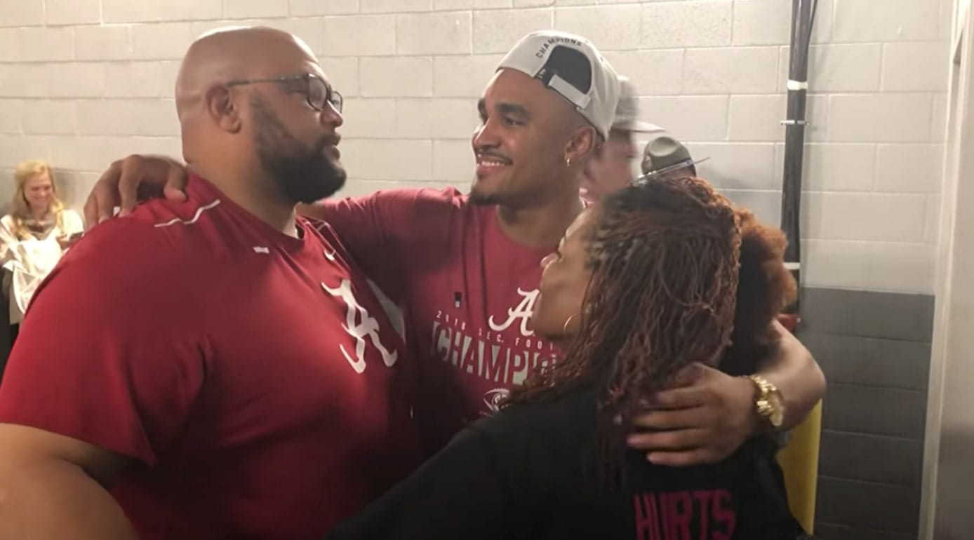 Image of Jalen Hurts with his parents, Pamela and Averion Hurts