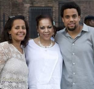 Image of Michael Ealy with his mother and sister
