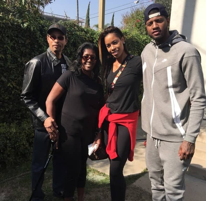 Image of Paul George with his sister and parents, Paulette George and Paul George, Sr.