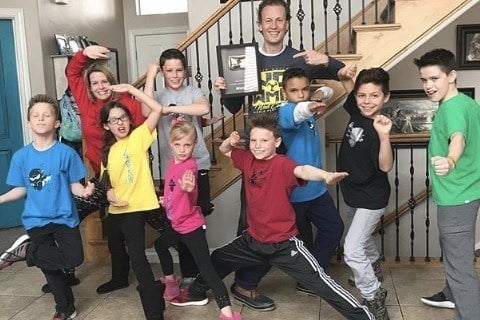 Image of Payton Myler with her father, Shane Myler and the rest of the Ninja Kidz