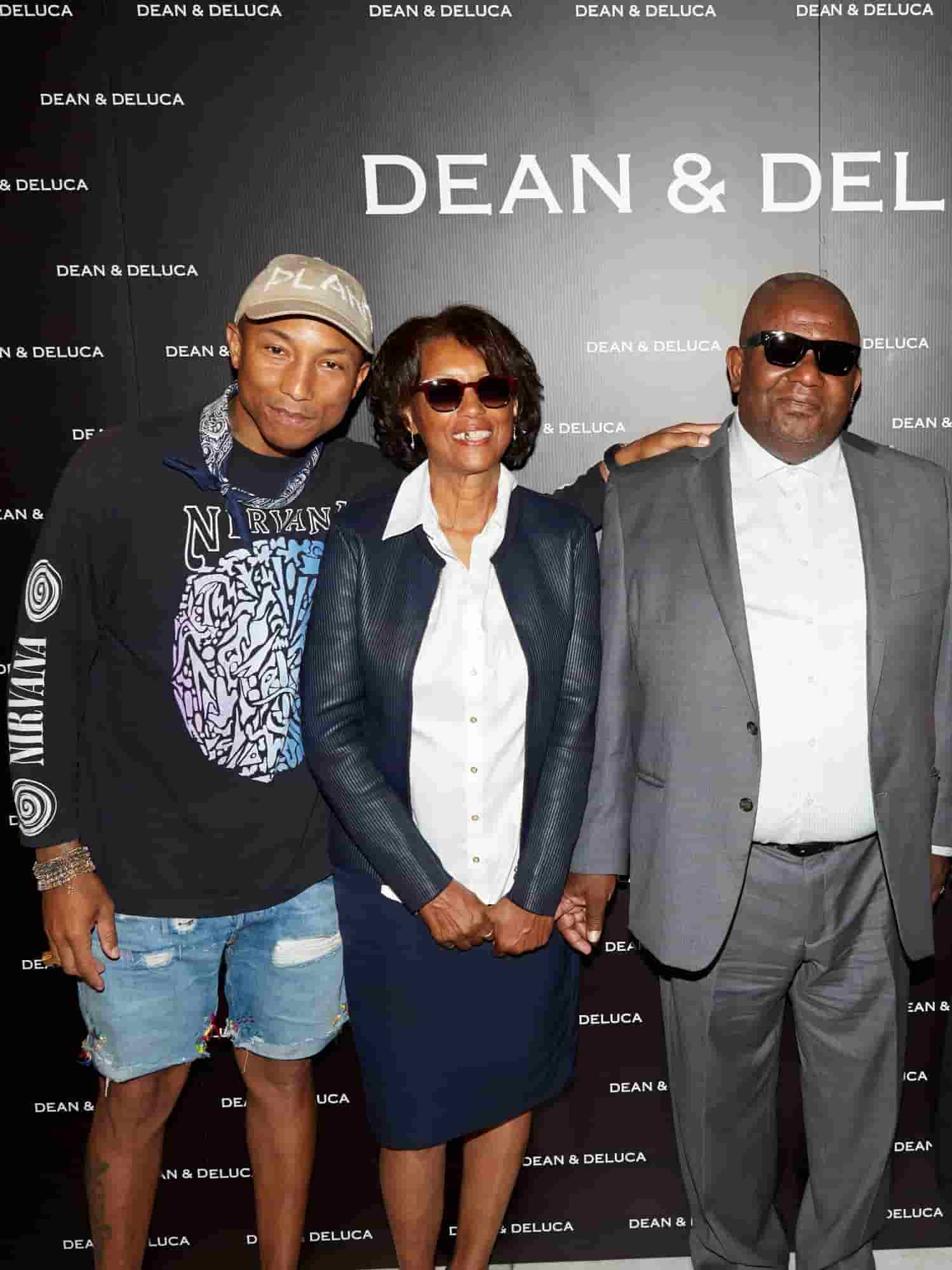 Image of Pharrell Williams with his parents, Pharaoh and Carolyn Williams